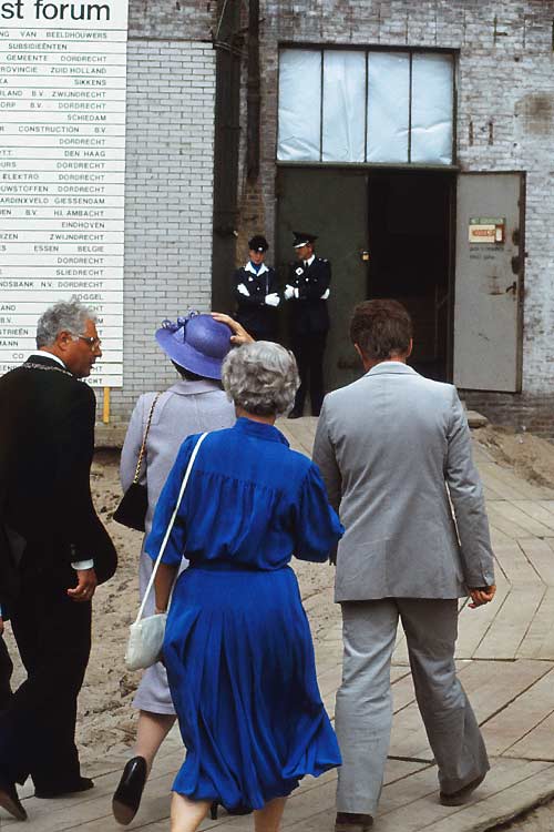 Escorting the Queen Beatrix into the factory buildings where the East West Forum took place in Dordrecht, the Netherlands.