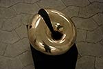 extorus, a polished bronze sculpture.