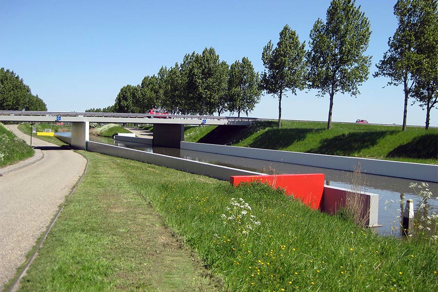 polychrome bridge in Dirksland NL in red, yellow, blue, green, black, white and grays