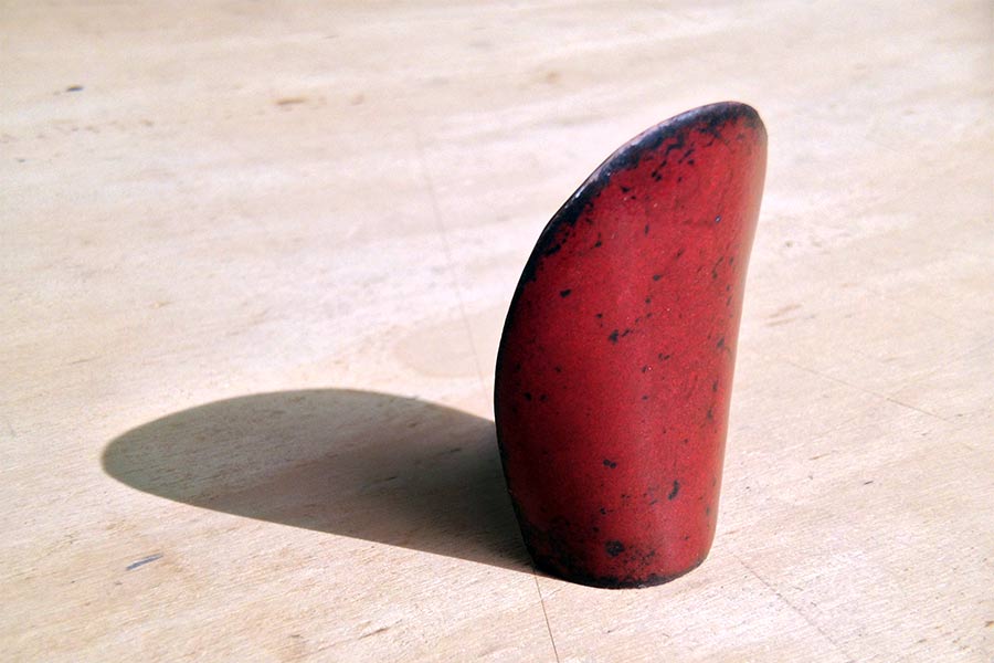 nail - red enameled object