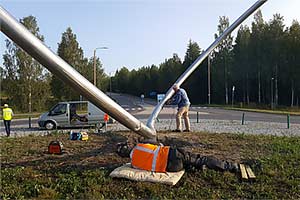 Grinding my stainless steel sculpture on a roundabout in Finland.